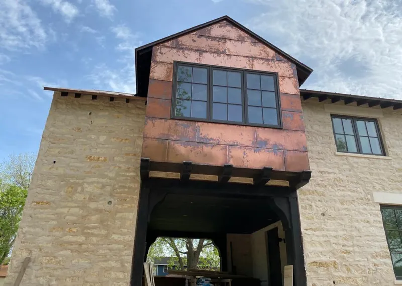 Copper metal panel facade on a stone building for Metal Roof Coating in Claymont
